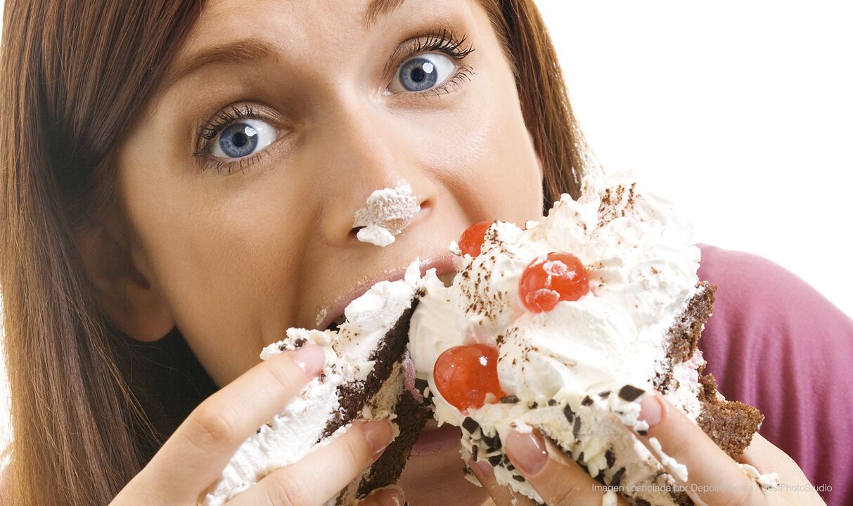 The girl eats a cake and gets better at losing weight